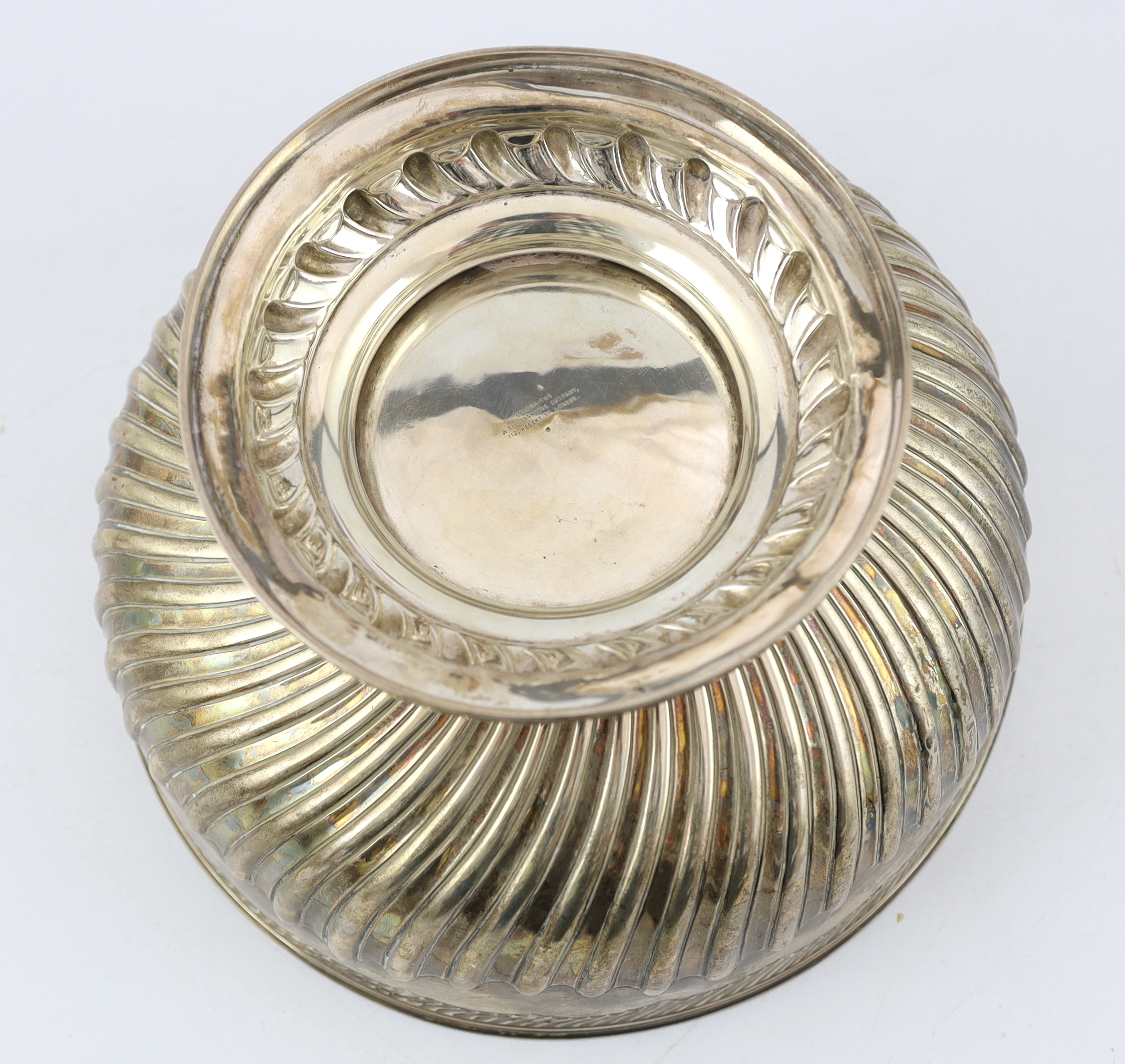 A late Victorian demi fluted silver circular punch bowl, by Goldsmiths & Silversmiths Co. Ltd., diameter 32cm, 42.6oz.